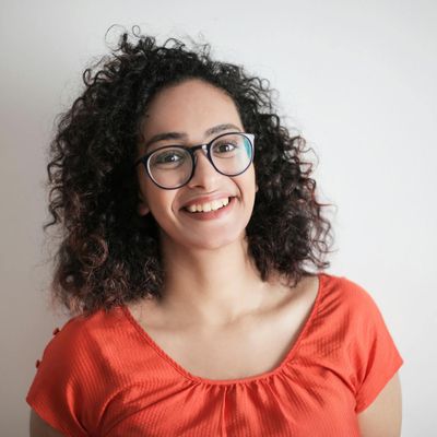 A person in a comfortable seated position with eyes closed.