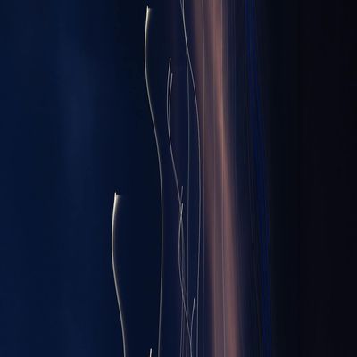 Abstract image of light trails suggesting movement and energy.